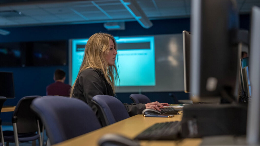 Female graduate student working in a classroom