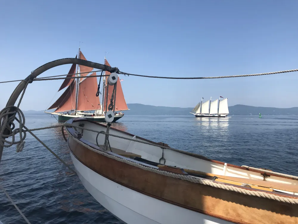 Aboard Schooner Stephen Taber looking at Schooner Angelique (red sails) and the Schooner Victory Chimes in the background.