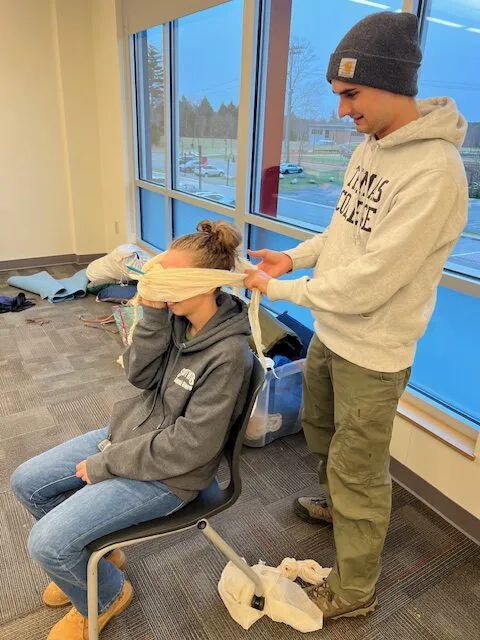 Students being trained in outdoor first aid learned and practiced skills to deal with a myriad of injuries associated with the outdoors including soft tissue wounds, broken limbs, skin burns, shock, head injuries, hypothermia, heart attacks, and diabetic events.
