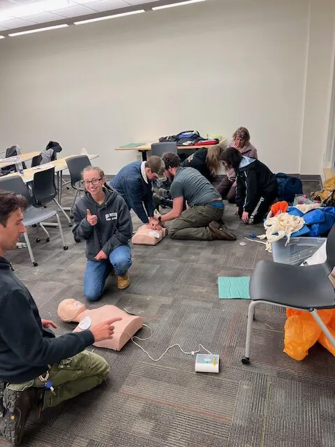 Students being trained in wilderness first aid learned and practiced skills to deal with a myriad of injuries associated with the outdoors including soft tissue wounds, broken limbs, skin burns, shock, head injuries, hypothermia, heart attacks, and diabetic events.