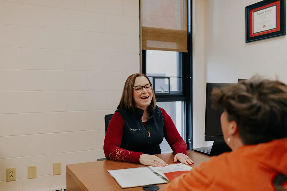 Jeannine Ross with a student in the SFS Office