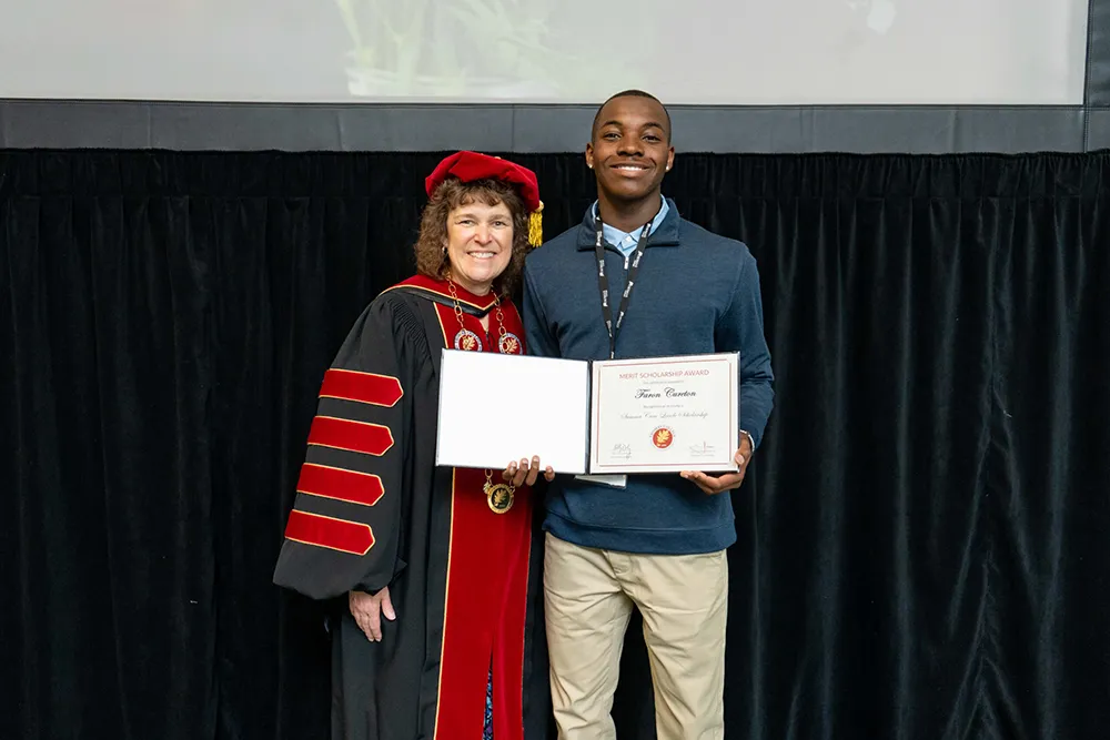 President Lachance with Merit Scholarship Recipient