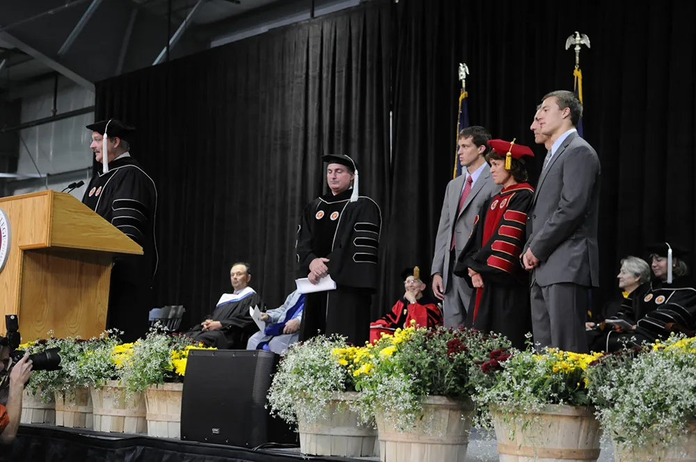 Thomas College Trustees on the commencement stage