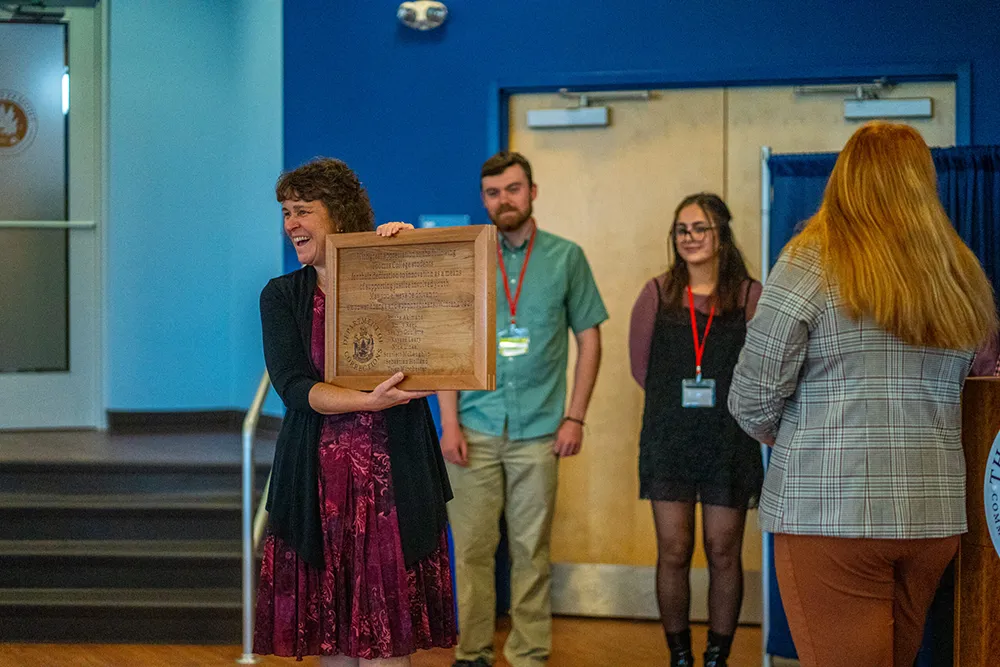 President Lachance presents Innovation Challenge award to students