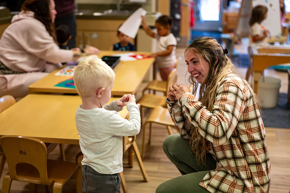Brittney Cayford with student at Educare in Central Maine