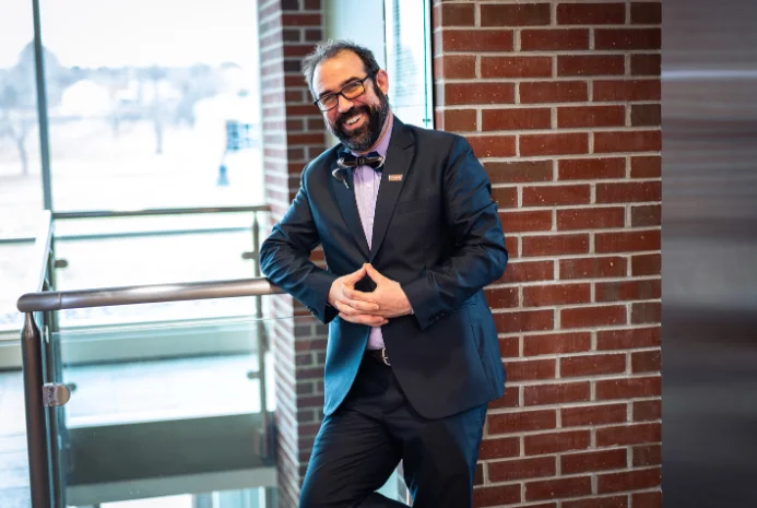 Thomas College staff member Luke Shorty poses on campus.