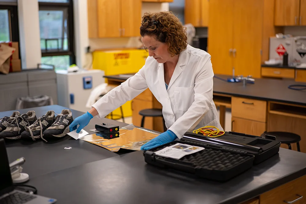thomas college science professor alicia mccarthy working in the science labs