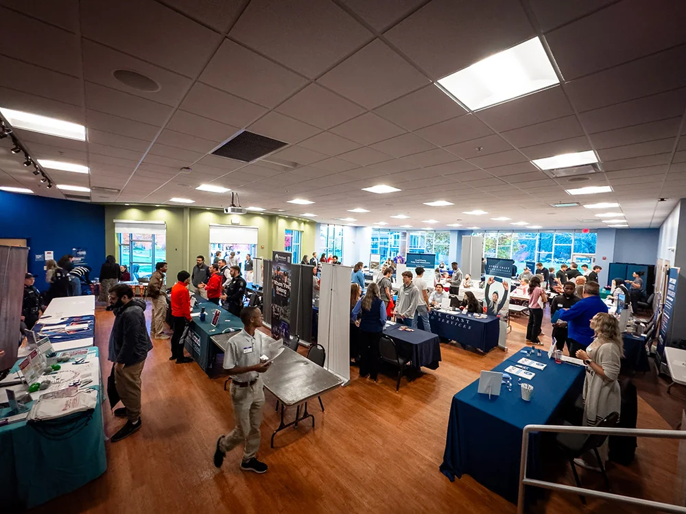 Students meet with employers during the October Career Fair at Thomas College in the Summit Room