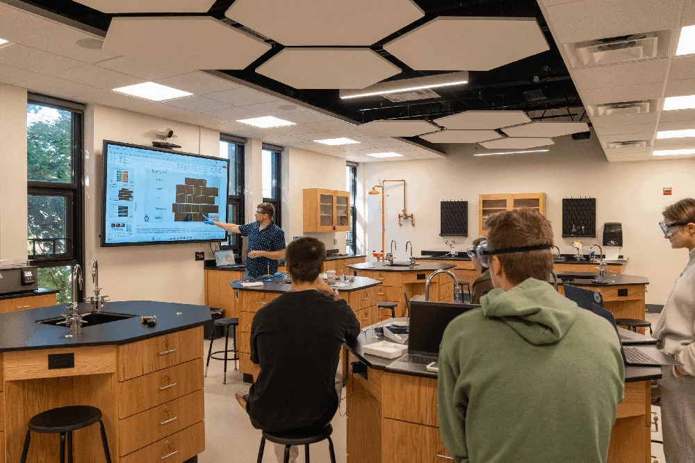 Thomas College science professor Josh Havelin teaching a class full of science students