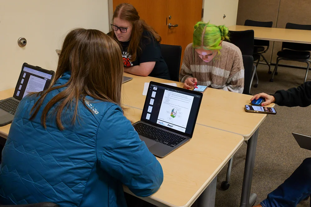 Thomas College Hosts First NASA-Supported Robotics Event for Maine Students: Students Sitting at Table