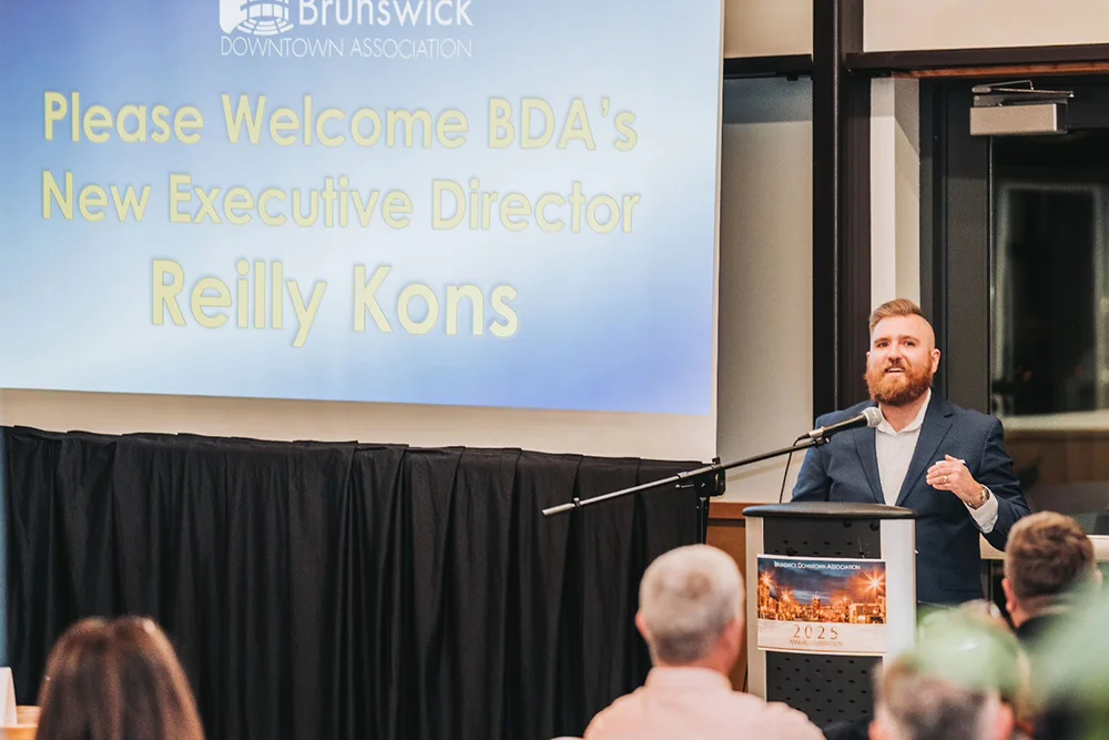 Thomas College alum Reilly Kons is the executive director of the Brunswick Downtown Alliance