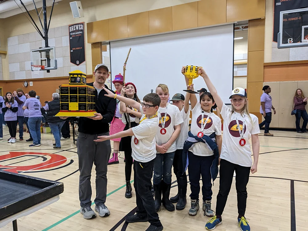 Robotics team celebrates a win