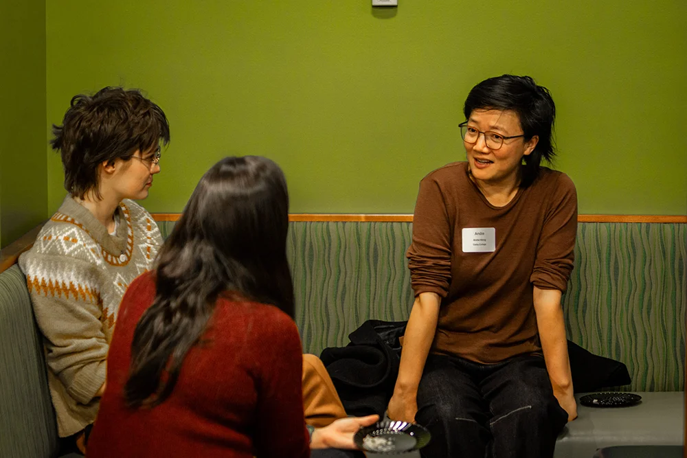 Women talking at the 2024 Central Maine Education Consortium hosted by Thomas College and Colby College