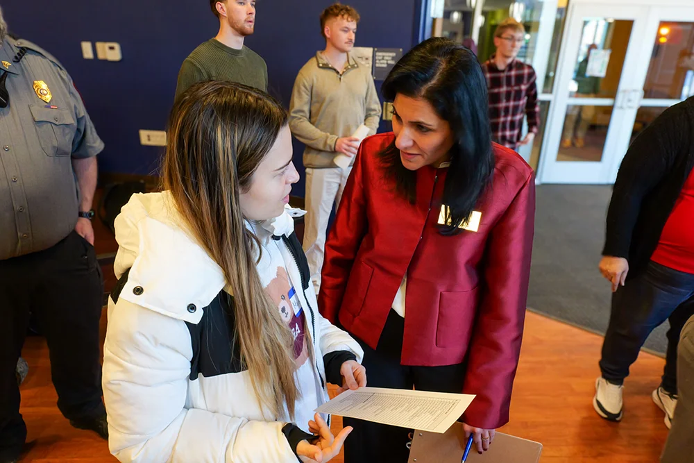 Thomas College Spring 2026 Career Fair: Suheir Alaskari with a student