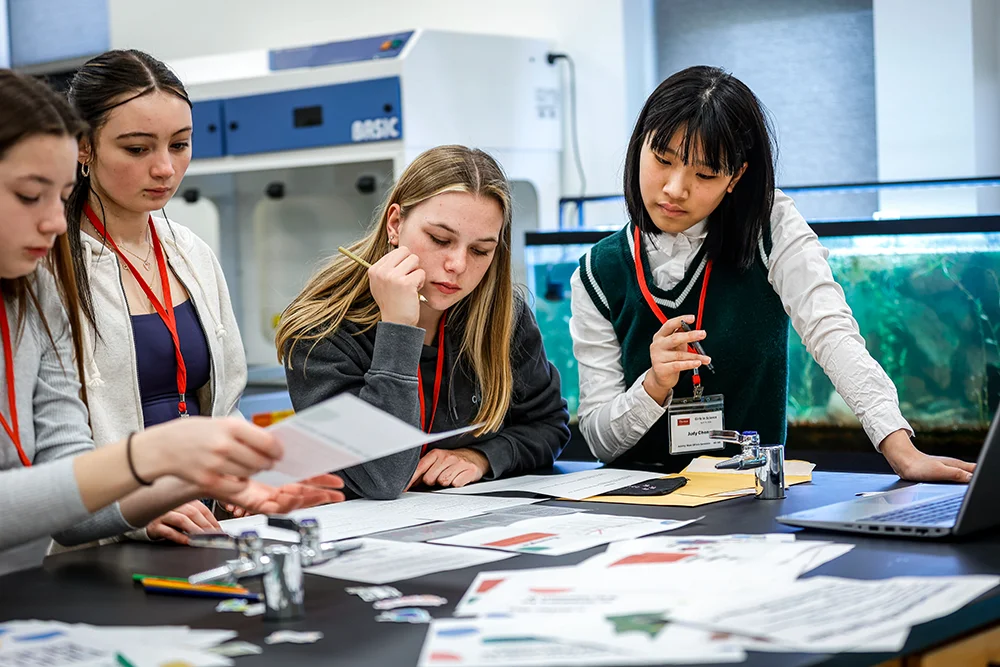 High school students work together in the science lab during Thomas College's Girls in Science Day