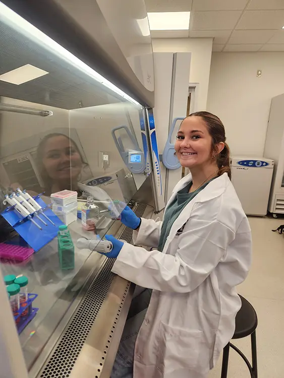 Thomas College student Alexis Spencer working in the science lab