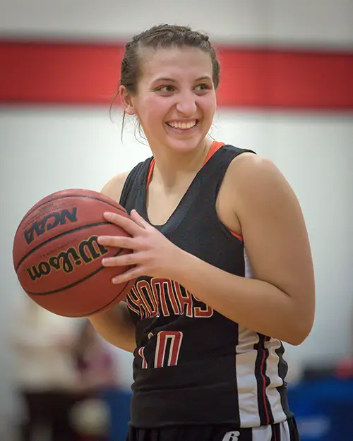 Thomas College women's basketball alumna Katie McAllister by alum Mark Bouvier