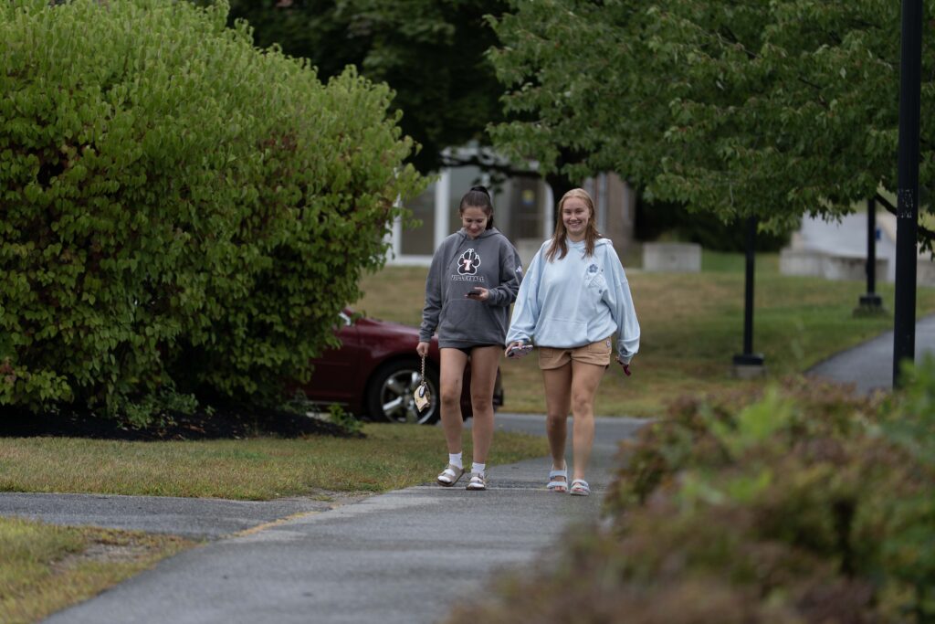 two students walking on campus during move in and the start of orientation