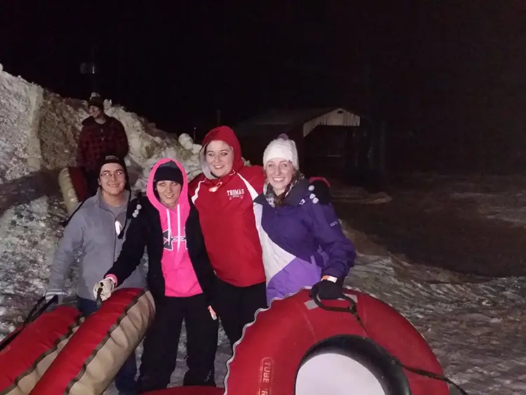 Students snow tubing at Sugarloaf during a GOAL outing